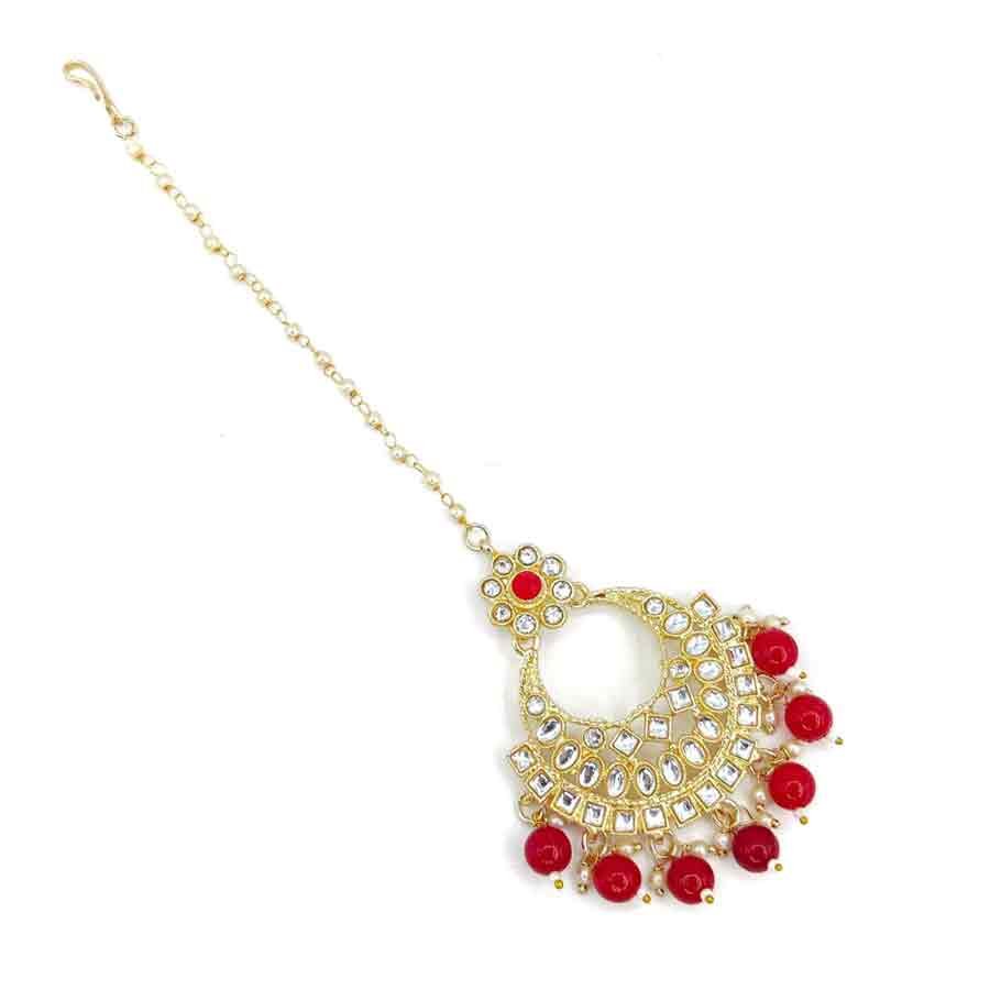 Look your best on traditional occasion by adorning this orange colour fancy maang tika. It is studded with sparkling white colour stones along with beads and feature wonderful design. This classy maang tika is made from golden finish metal and has orange droplet for added attraction. So order now!