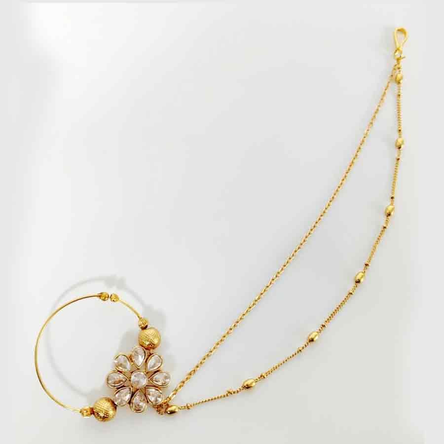 Kayaa fashion Beautiful Simple Designed Kundan Pearl Nose Ring/Nath/Nathiya with Gold plating is one of the most beautiful Nose Rings you would have ever seen. Bridal Gold Plated Nathiya With Hair Chain Jewellery.