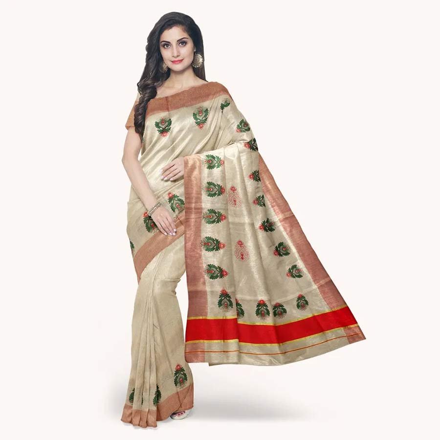 A beautiful amalgamation of ethnic prints and shimmering kasavu. Adorned with traditional motifs in rich kasavu and vivid hues, this Kerala Tissue saree beautifully combine the classic and the contemporary.