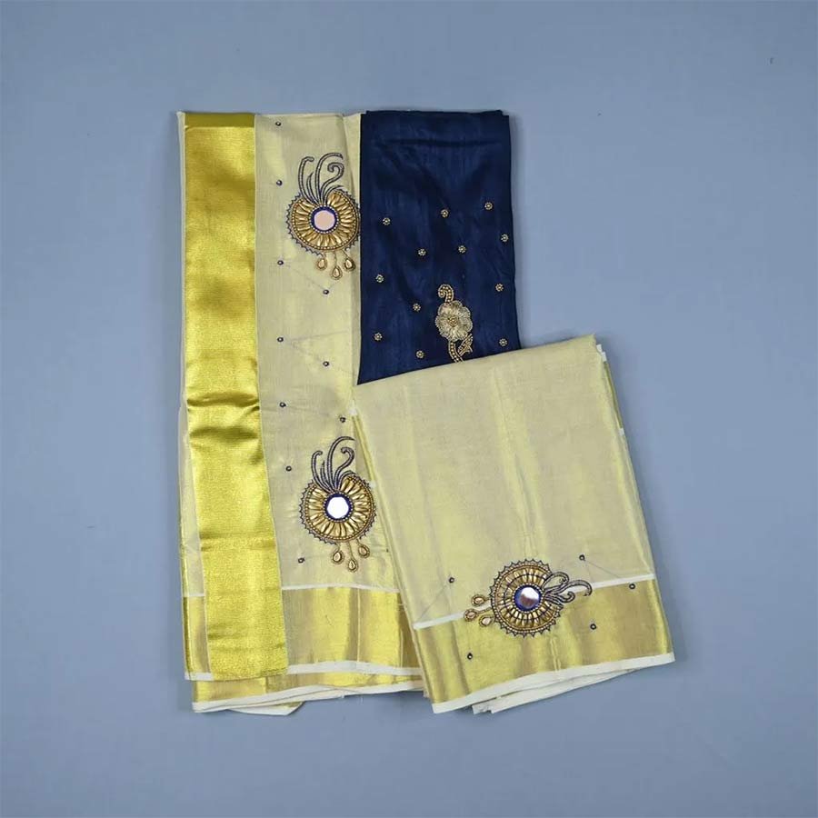 Realistic in beauty and Enigmatic in feel. An ethnic Kerala tissue kasavu Mundum Neriyathum adorned with floral embroidery in zari borders. Add these beautiful intricate hand-embroidered set mundu to your collection, available only at Ekatva.