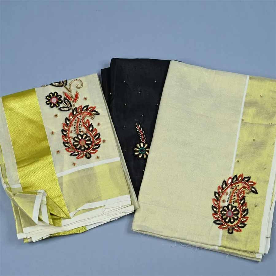 Realistic in beauty and Enigmatic in feel... An ethnic Kerala tissue kasavu Mundum Neriyathum adorned with floral embroidery in zari borders. Add these beautiful intricate hand-embroidered set mundu to your collection. Made to Order