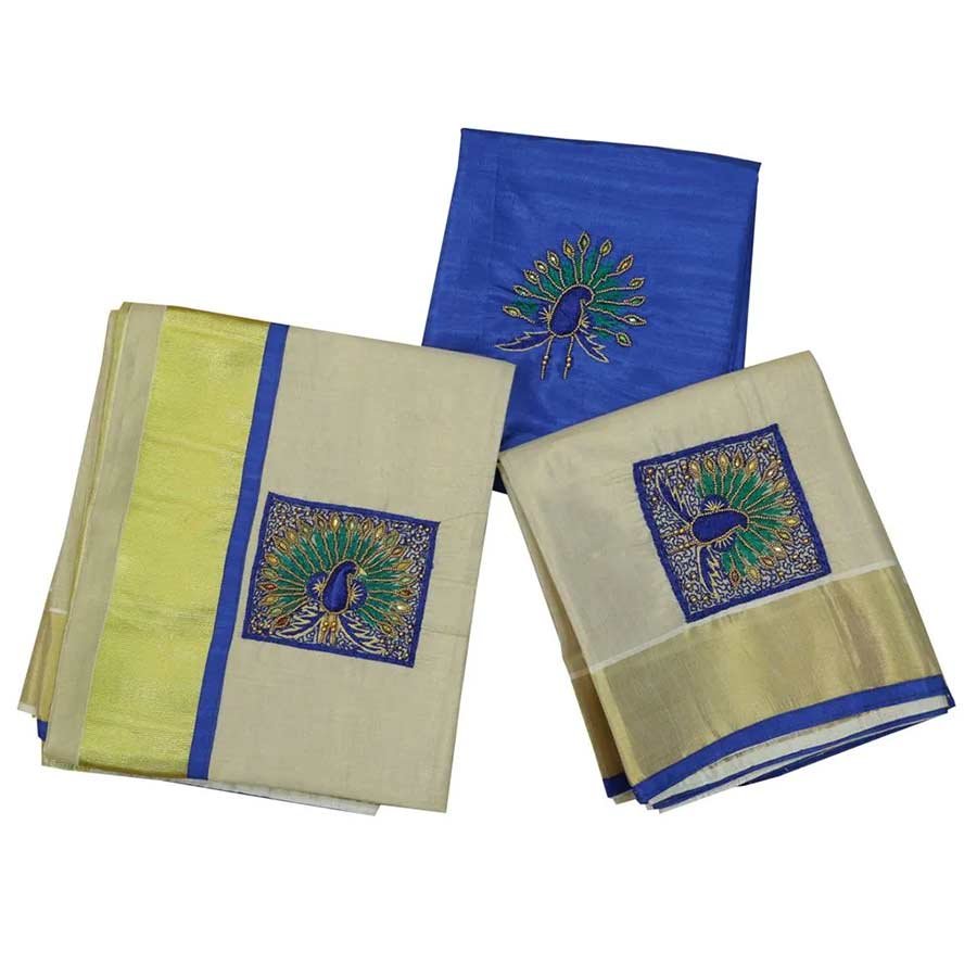 An exquisite drape from Ekatva s tissue set mundu collection. This beautiful Kasavu Mundum Neriyathum is adorned with aari embroidered paisley motifs in royal blue and Resham threads and enhanced with sequins, mirrors, and beads. Make your festive days more memorable with unique designs.